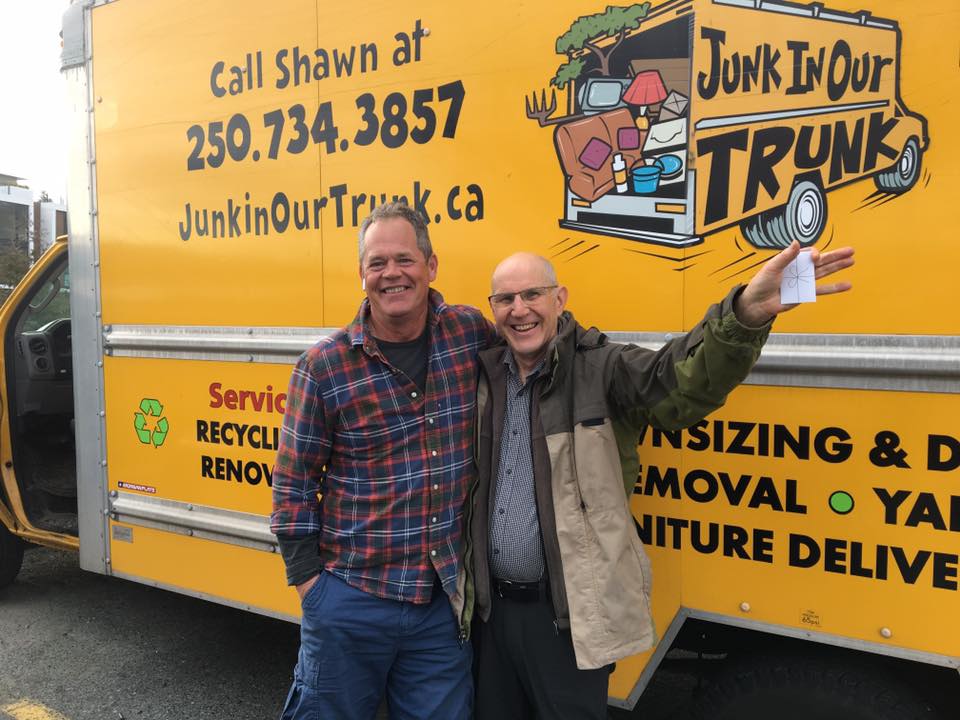 Shawn celebrating with a long-time Nanaimo client by the truck